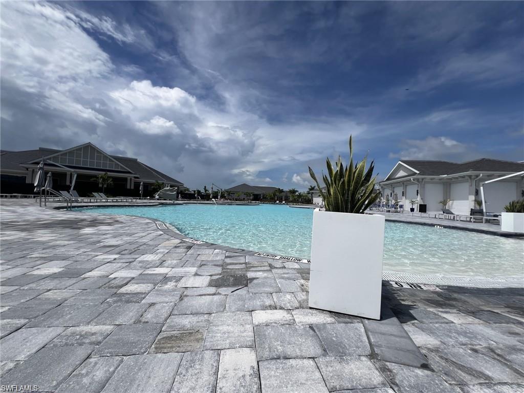 Community pool with a patio area