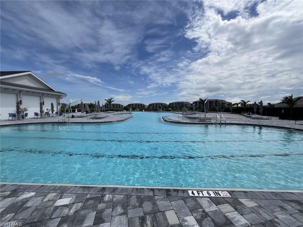 Community pool with a patio area