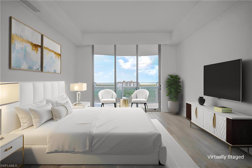 Bedroom featuring access to outside, light wood-style flooring, and floor to ceiling windows