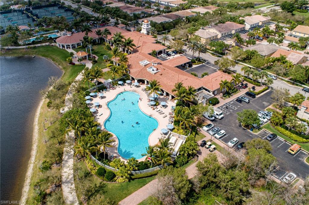 Drone / aerial view of a pool and a large lake