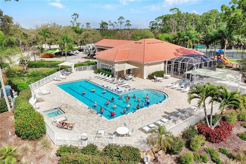 Clubhouse with 60 ft lap pool and hot tub, fitness room, and court sports.