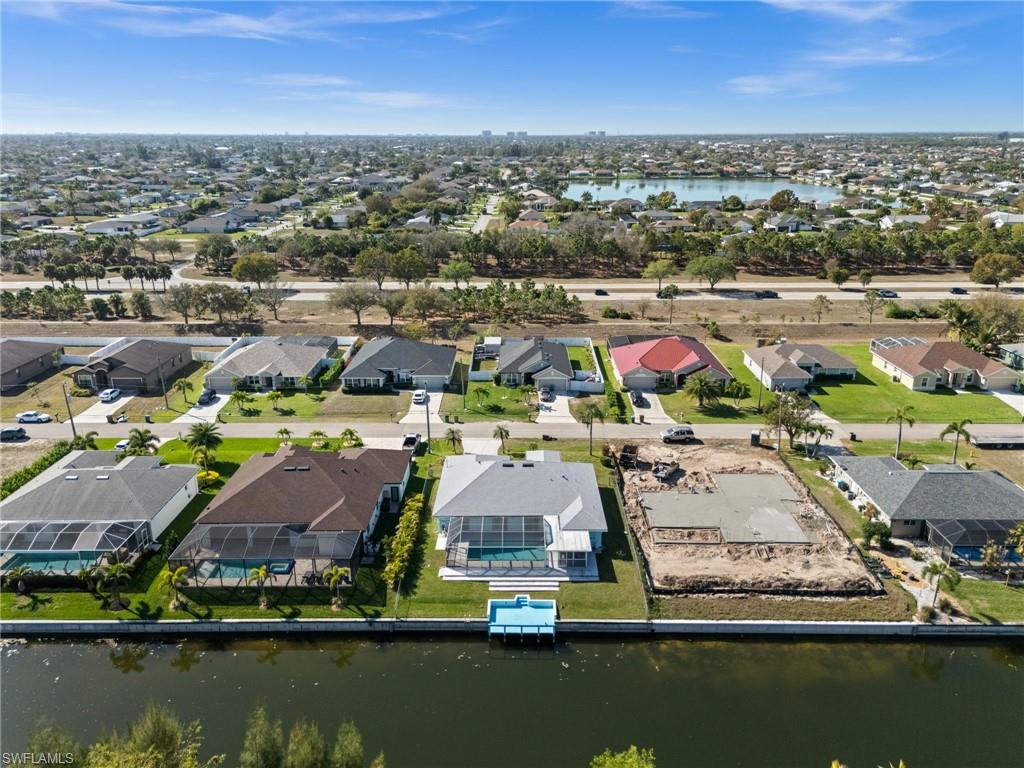 Aerial overview of property's location with nearby suburban area