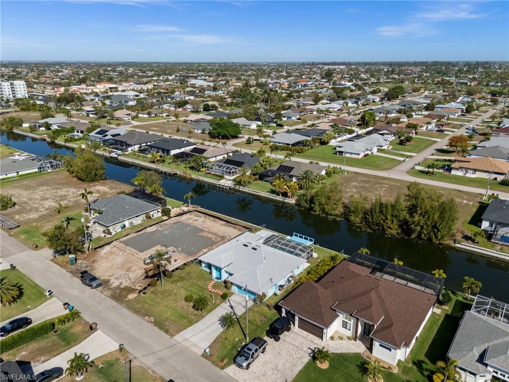 Aerial overview of property's location with nearby suburban area on canal