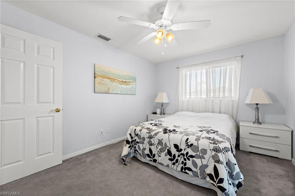 Bedroom with carpet and a ceiling fan