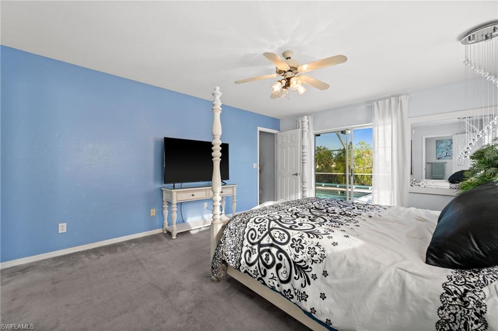 Bedroom with access to outside, and a ceiling fan