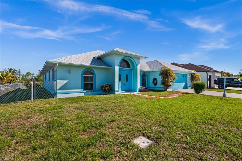View of front of house featuring a garage, stucco siding, roof with shingles, driveway