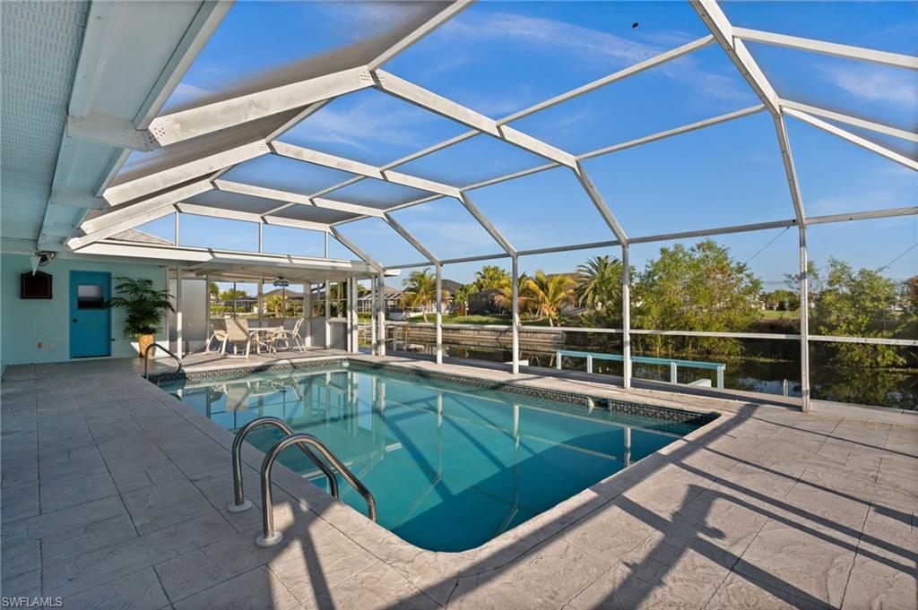 Swimming pool featuring a lanai, and a patio