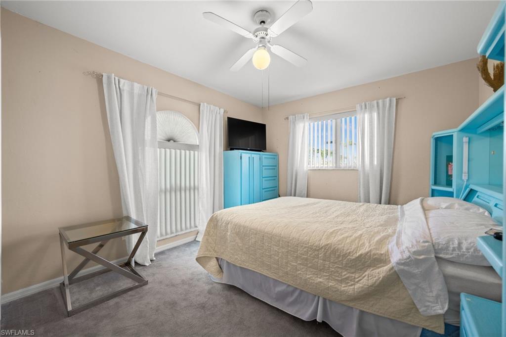 Bedroom with carpet flooring and ceiling fan