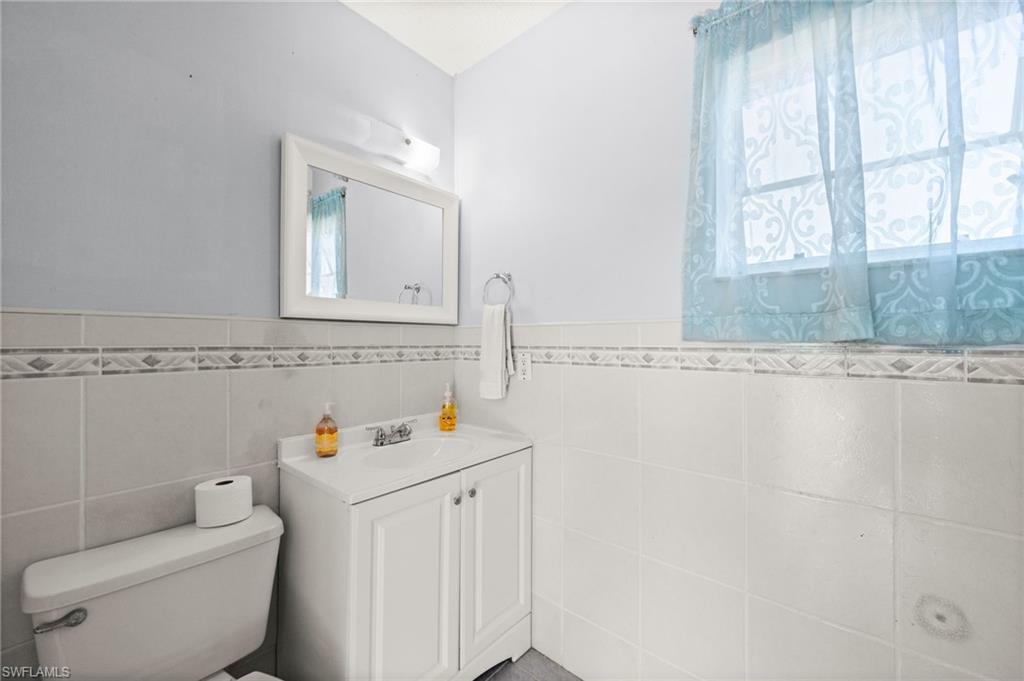 Bathroom featuring vanity, plenty of natural light