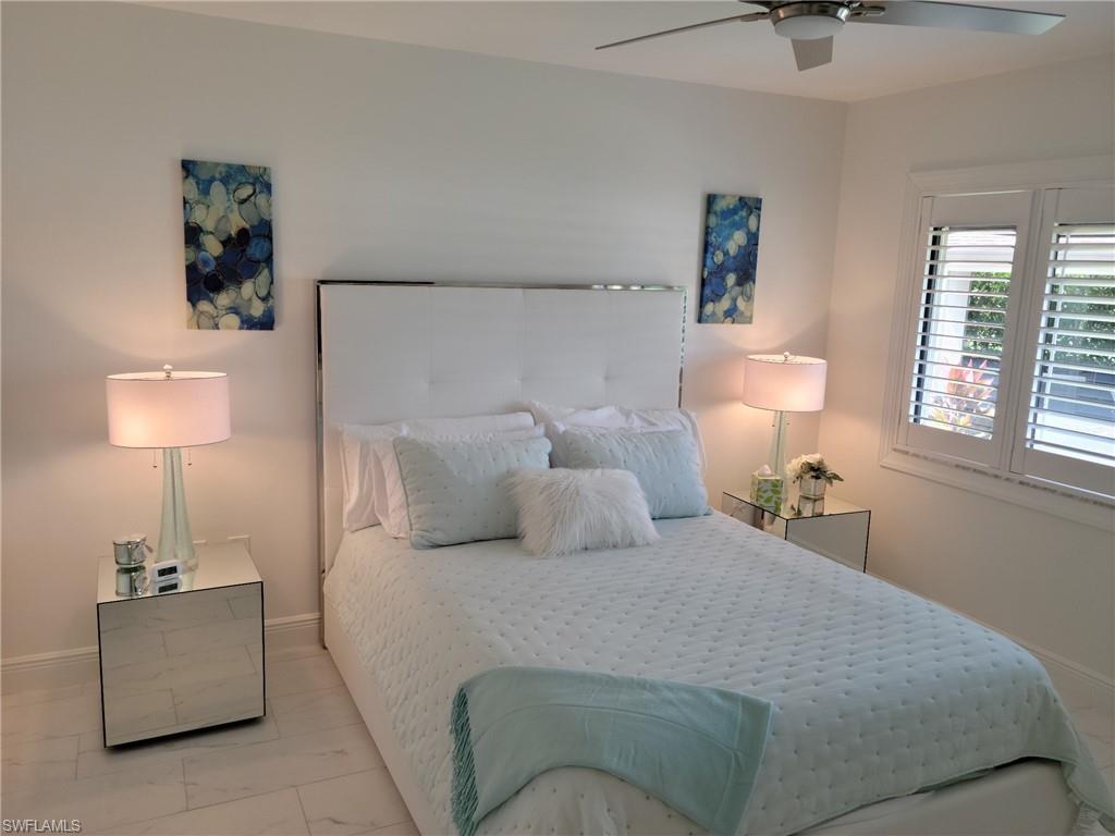 Guest bedroom with full size ed, plantation shutters, guest bath.