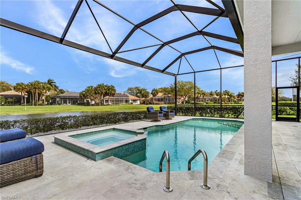 Expansive pool deck, fully screened lanai cage with Frameless Lake Views.