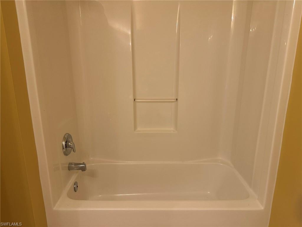 Full bathroom with shower / bathtub combination