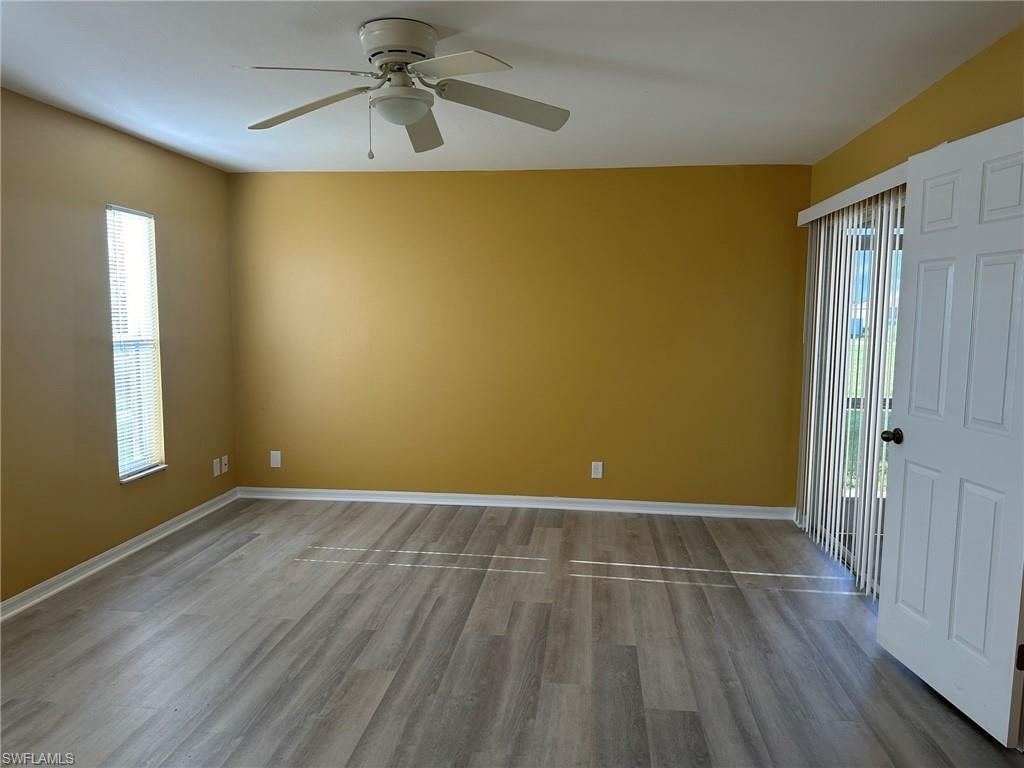 Unfurnished room with light wood-style flooring and ceiling fan