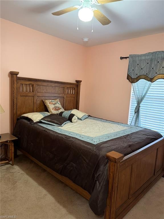 Bedroom with light carpet and ceiling fan