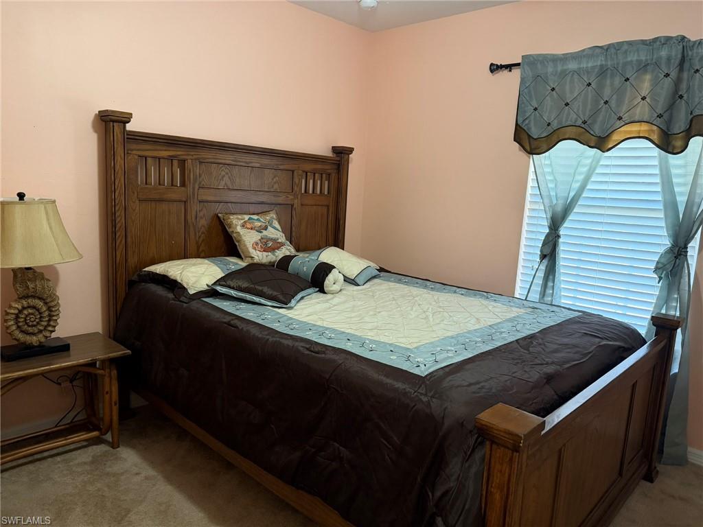 Bedroom with light carpet