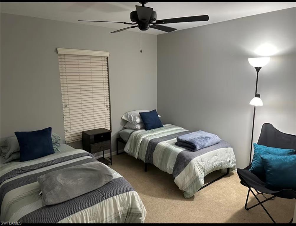 Bedroom with carpet floors and a ceiling fan