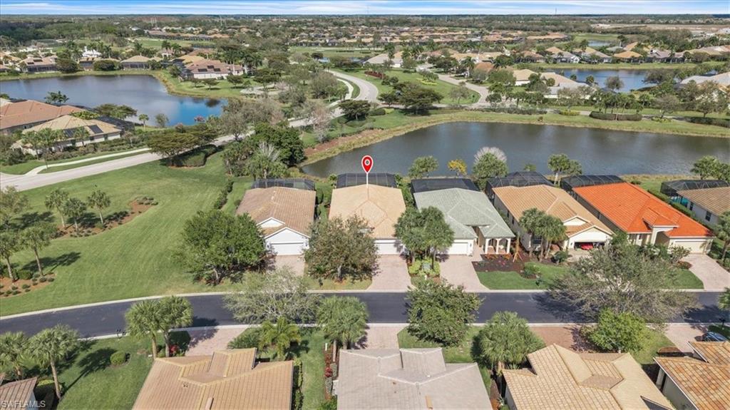 Aerial perspective of suburban area with a nearby body of water