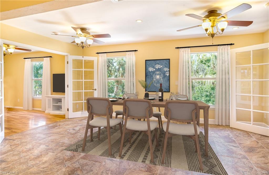 Dining area featuring ceiling fan, light stone finish flooring, and recessed lighting