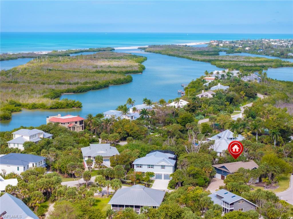 Aerial view of residential area with a nearby body of water