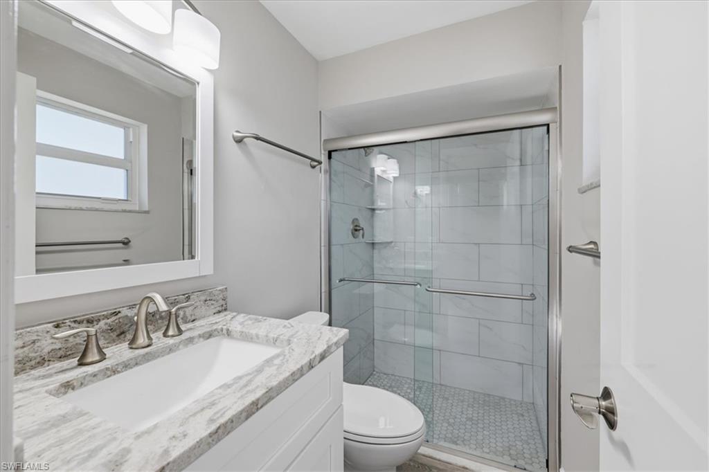 master Full bathroom featuring vanity and a shower stall