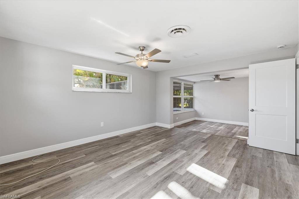 Master bedroom featuring ceiling fan, light wood-style flooring, and healthy amount of natural light