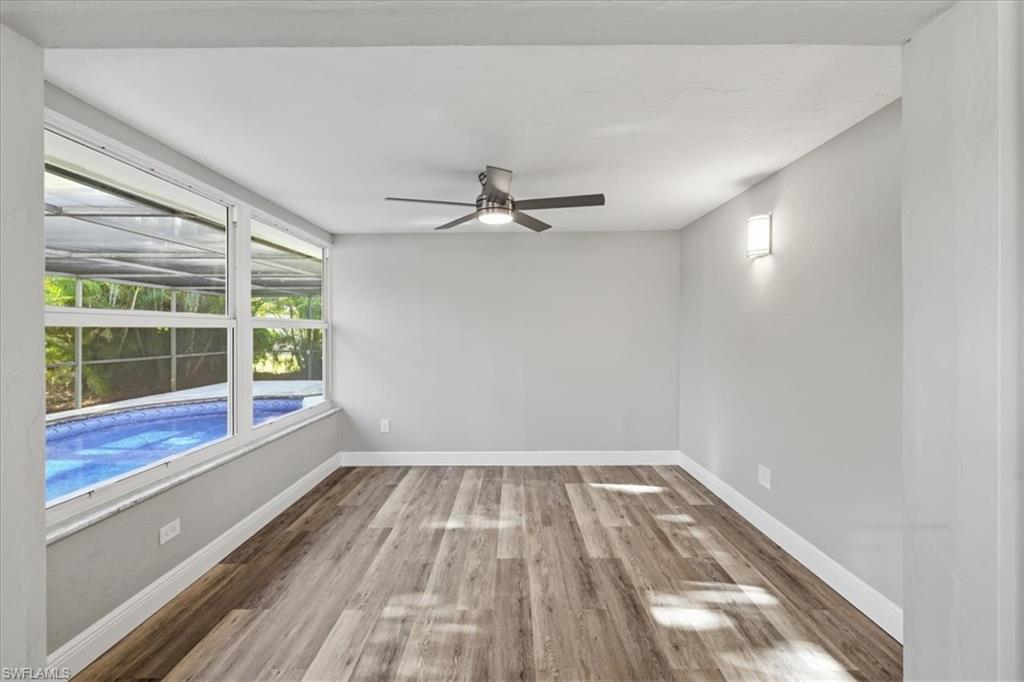 Empty room featuring light wood-style floors and a ceiling fan