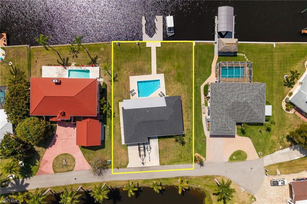 Aerial view of property's location featuring property boundaries highlighted and a pool