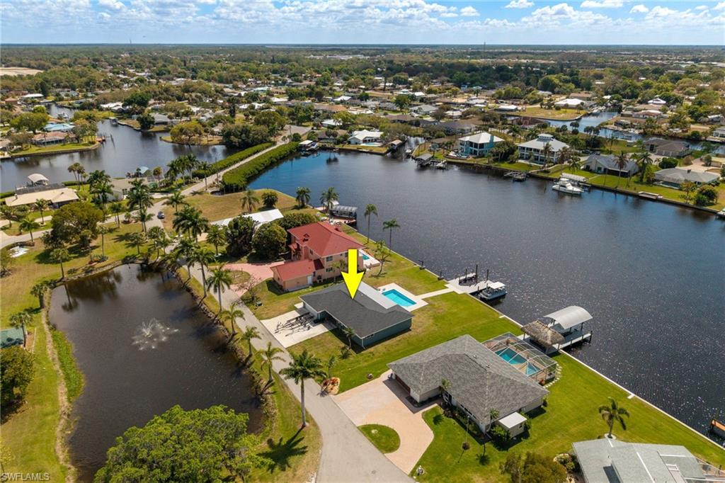 Aerial view of residential area featuring a large body of water