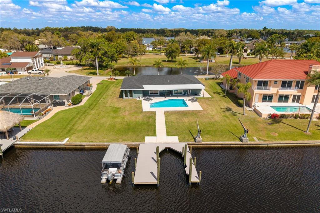 Aerial view of a nearby body of water and a pool
