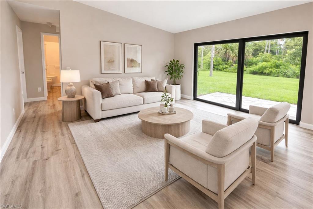 Living room featuring light wood-style flooring