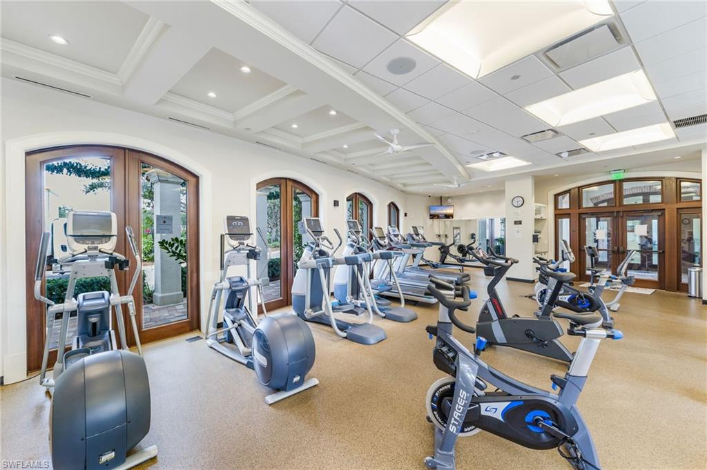 Workout area featuring french doors, coffered ceiling, and recessed lighting