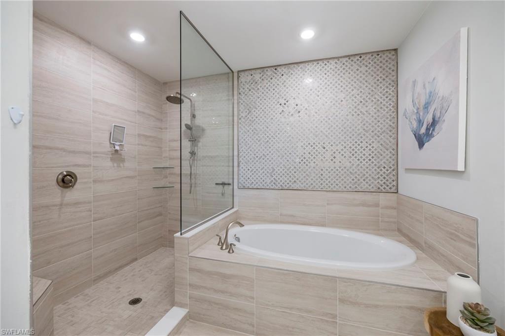 Full bath with a garden tub and walk in shower