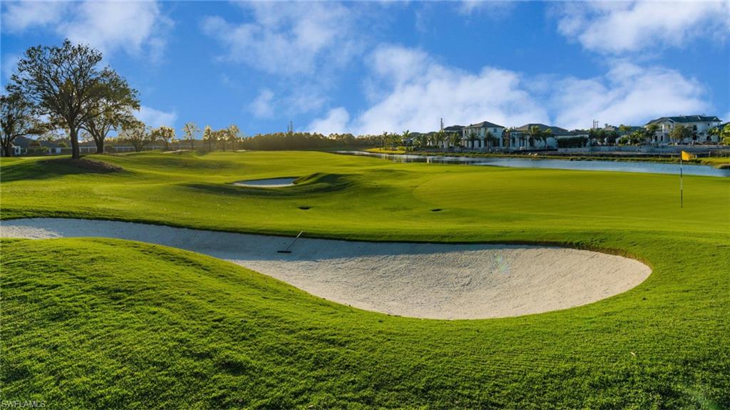 View of home's community with a water view, view of golf course, and a residential view