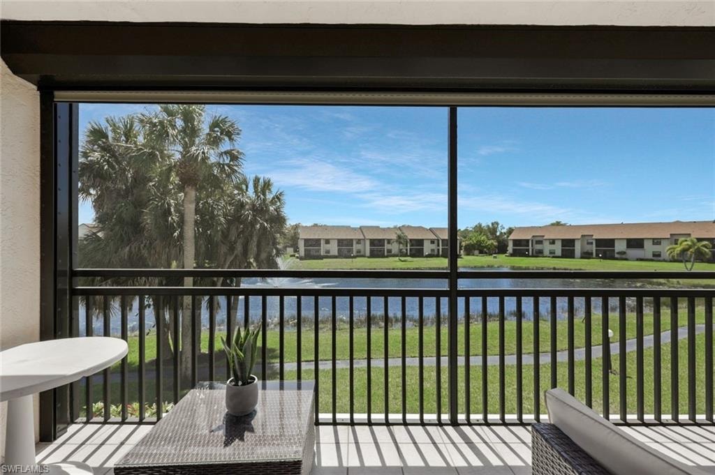 Unfurnished sunroom featuring a water view