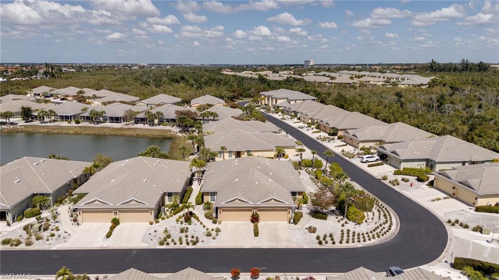 Aerial view of residential area featuring a large body of water