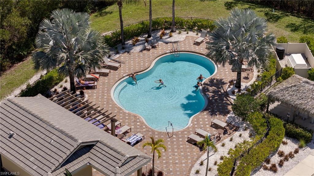 Community pool featuring a patio