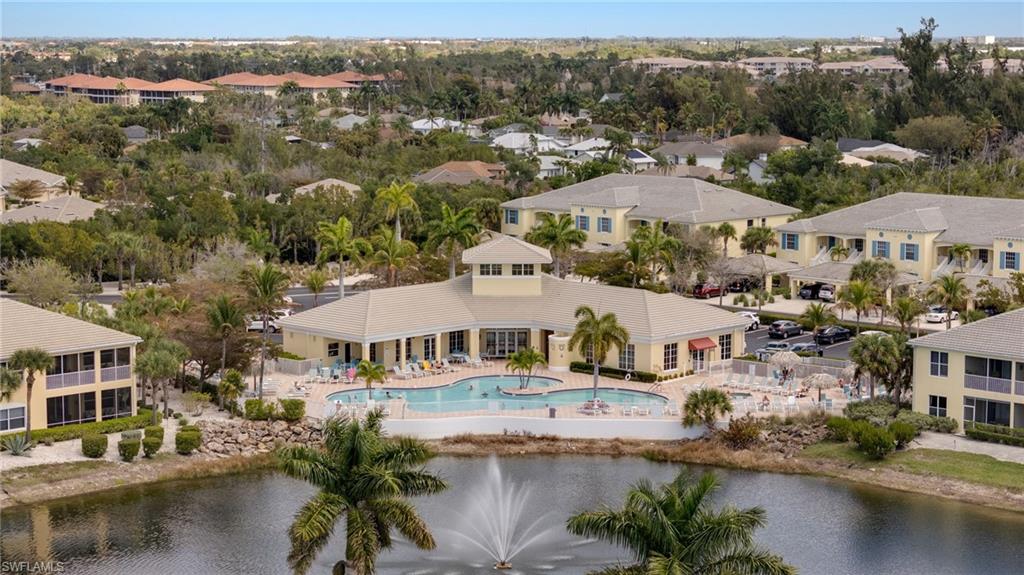 Aerial perspective of suburban area featuring a large body of water