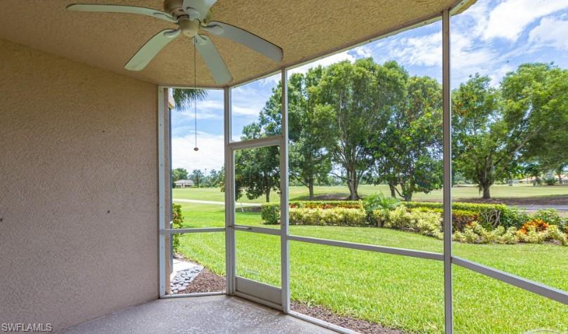 Unfurnished sunroom with ceiling fan