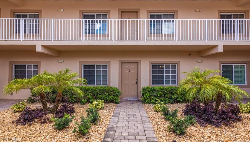 View of exterior entry featuring stucco siding