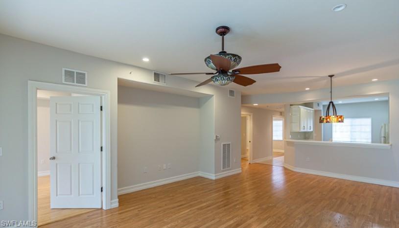 Unfurnished living room with baseboards, recessed lighting, visible vents, and light wood-type flooring