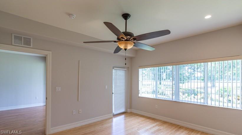 Spare room with visible vents, a ceiling fan, recessed lighting, light wood finished floors, and baseboards