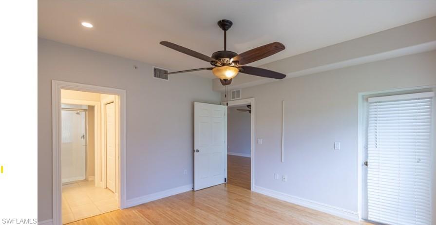 Unfurnished bedroom featuring visible vents, recessed lighting, light wood-type flooring, and baseboards
