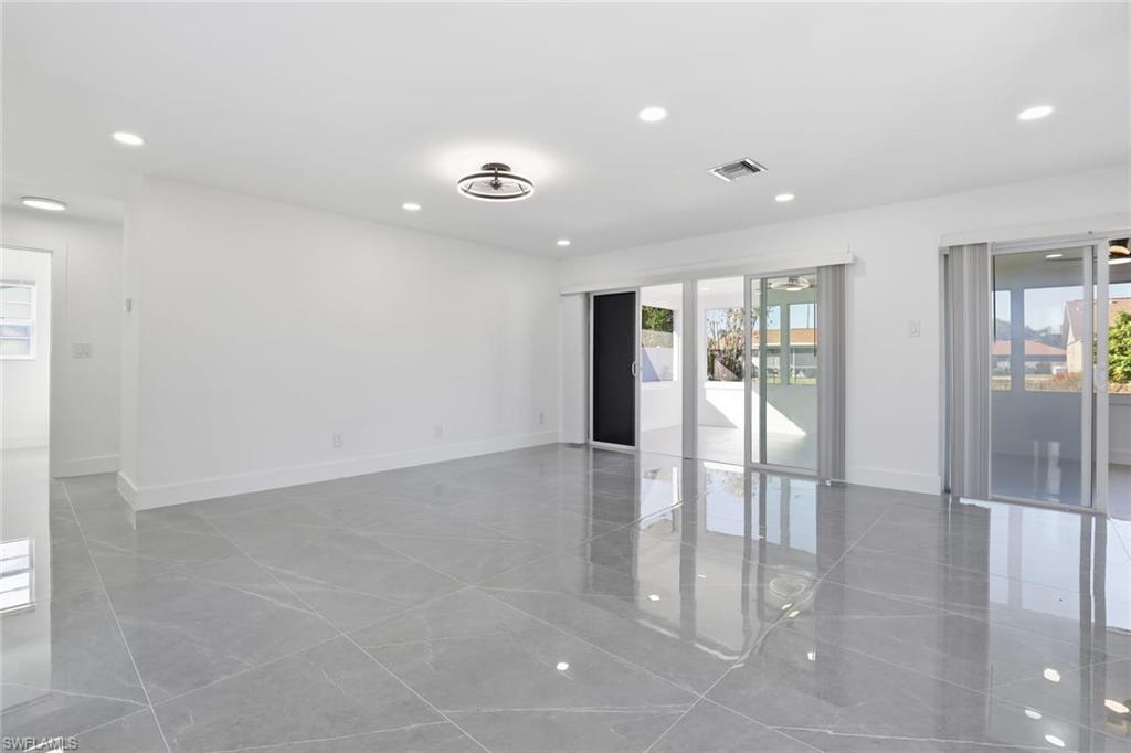 Spare room featuring recessed lighting and baseboards