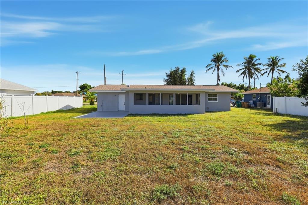 Rear view of property with a patio and stucco siding