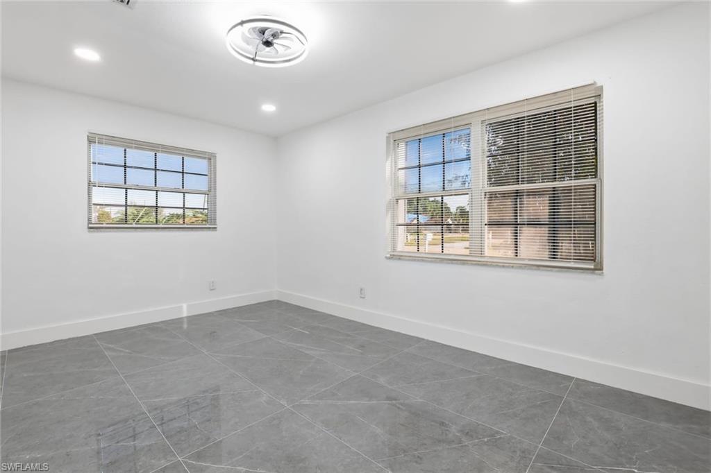 Spare room featuring tile patterned floors and recessed lighting
