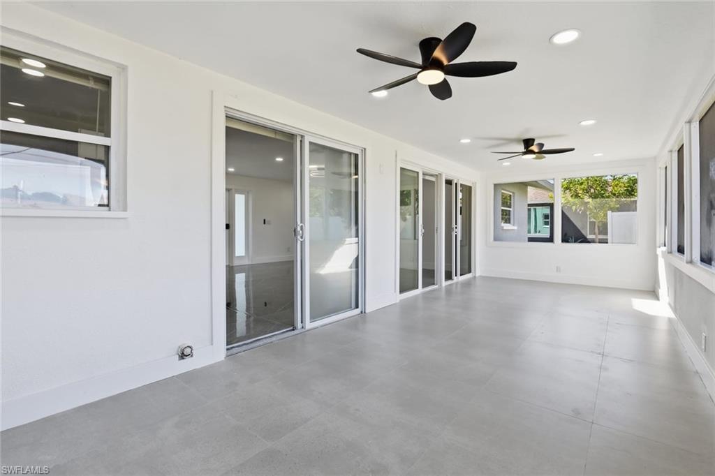 Unfurnished sunroom featuring recessed lighting