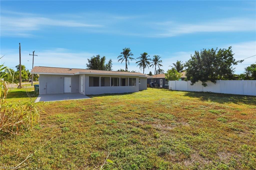 Back of property featuring a patio and stucco siding