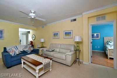 Living room wi ceiling fan, and light tile floors