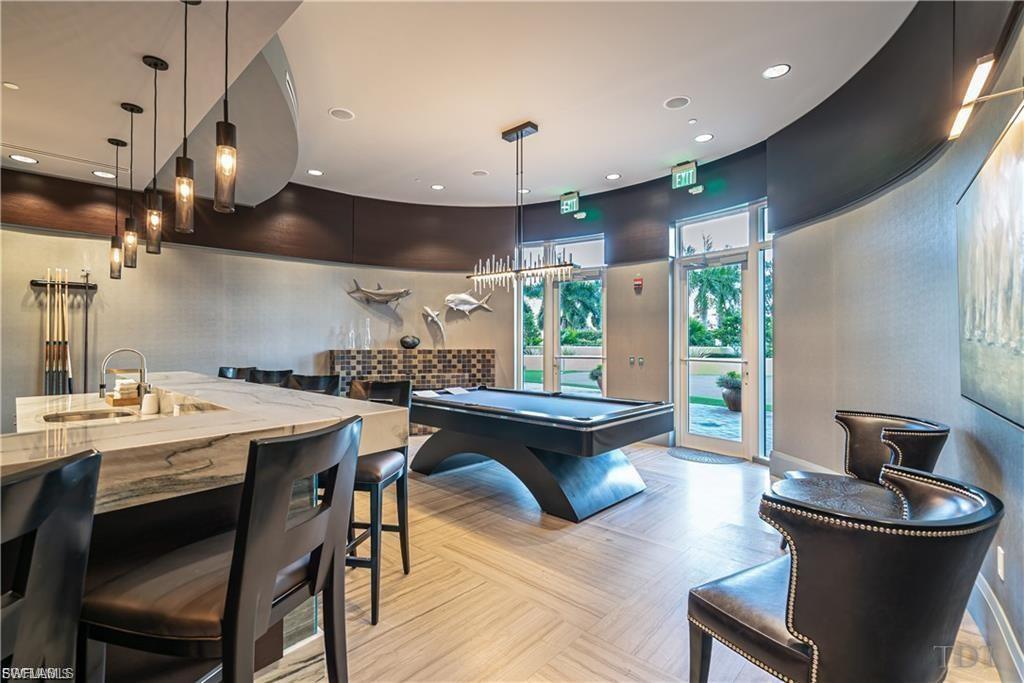 Billiards anyone! Game room with fire place, bar and a (full wall) HD interactive golf course simulator.
