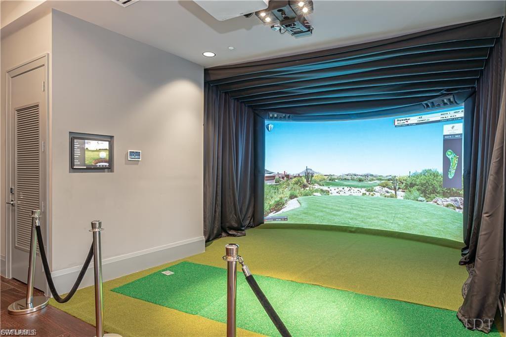 Billiards anyone! Game room with fire place, bar and a (full wall) HD interactive golf course simulator.